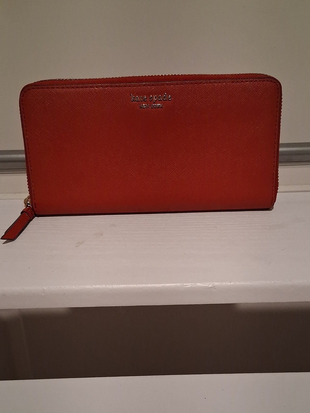kate spade zip-around wallet in orange